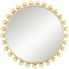 a round mirror with gold balls on the edges and an oval frame, in front of a white background