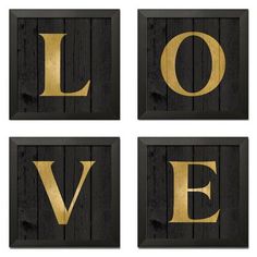 four wooden signs with the word love spelled in gold letters on black wood planks