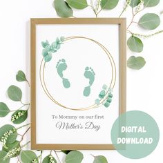 a card with the words to mommy on our first mother's day in gold and green