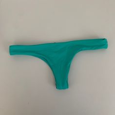 Cheeky Style, Never Worn, Hygienic Liner Still Attached Green T-back Swimwear For Beach, Green Seamless Swimwear For The Beach, Green Stretch T-back Swimwear, Beachy Green Seamless Swimwear, Green Seamless Beachy Swimwear, Turquoise Stretch Swimwear Beachwear, Turquoise Stretch Swimwear For Beachwear, Turquoise Stretch Swimwear With Triangle Top, Stretch Turquoise Swimwear For Pool