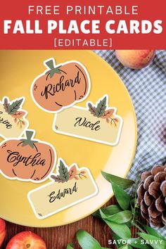 the free printable fall place cards are on a plate next to apples and pine cones