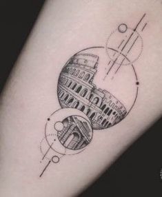 a black and white photo of the leaning tower of pisa tattoo on the right arm