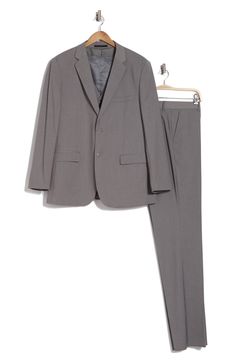 Bring understated elegance to the table in this three-piece suit crafted from rich fabric in a classic single-breasted silhouette. Jacket has notched lapels; chest welt pocket; front flap pockets Vest has front button closure; V-neck Pants have zip fly with button closure; front slant pockets; back button-welt pockets Jacket and vest are lined; trousers are lined to the knee 65% polyester, 35% viscose Dry clean Imported Suit has a 6” drop, meaning that a size 38R jacket is paired with size 32 pa Classic Office Sets Single Breasted, Classic Notched Suits With Welt Pockets, Classic Single Breasted Business Sets, Tailored Sets With Notch Lapel And Hidden Button Closure, Classic Business Sets With Collared Suit, Classic Business Sets With Suit Collar, Classic Workwear Sets With Suit Collar, Classic Notched Business Suits, Classic Workwear Sets With Welt Pockets