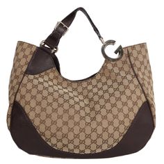 Authentic, pre-owned Brown Charlotte GG Canvas Hobo Bag. Features: brown GG logo print with leather accent, gold hardware, large double GG, magnetic snap top closure, brown textile interior lining with zipper slip pocket and patch pocket, flat leather adjustable handle strap. Add your wallet, keys, phone, cosmetic bag, and much more. You're going to love this Gucci! Authenticity code: 203504 502752 Made in Italy Strap Drop: 8" Canvas Hobo Bag, Textile Interior, Stylish Handbags, Gg Logo, Bag Packaging, Carry All Bag, Hobo Bag, Tan Leather, Logo Print