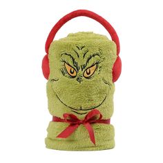 the grin face has red headphones on it's ears and is wearing a green towel