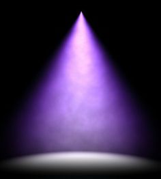 a purple light shines brightly in the dark