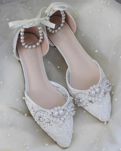 white wedding shoes with pearls and bows