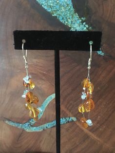 "MOTHER's Day Promotion!! Free Gift wrapping! Just place a note on comments indicating it is a gift and any personal note you would like to add! These fun and stylish natural stone earrings are perfect for everyday, appearances, or interview! Size of earrings: 2.75\" Long. Stones: natural baltic amber beads and aquamarine chips Post: sterling silver long earwires Looking for the perfect pair of earrings for a special occasion. We specialize in custom work in fashion jewelry, pearls, and natural Amber Citrine Earrings With Ear Wire, Amber Dangle Earrings For Anniversary, Amber Dangle Earrings As Gift, Amber Dangle Earrings For Gift, Handmade Amber Earrings For Gift, Handmade Amber Earrings For Anniversary, Orange Citrine Earrings Gift, Amber Citrine Dangle Earrings, Hypoallergenic Amber Dangle Earrings