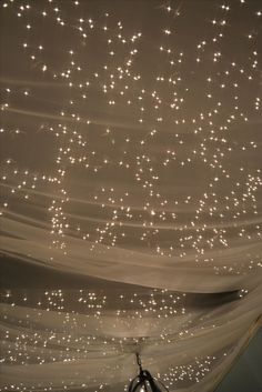 the ceiling is covered with white lights