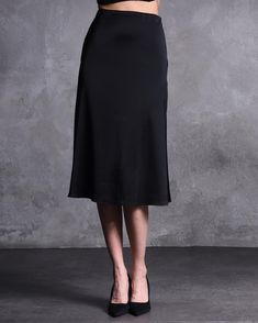 Step up your style game with this Black Satin High-Waisted Midi Skirt, designed for women who love a touch of elegance in their wardrobe. This sleek and sophisticated satin skirt is perfect for cocktail parties, evening events, or any special occasion where you want to stand out. Its high-waisted design and luxurious fabric create a flattering silhouette, making it a must-have for your formal wardrobe. 💫 🌟 Unique Features: 👠 High-Waisted Design: Cinches at the waist to create a flattering and elegant silhouette. ✨ Luxurious Satin Fabric: Smooth, shiny satin drapes beautifully, offering a polished and sophisticated look. 🎯 Midi-Length: Falls just below the knee, striking the perfect balance between modern and classic style. 🎉 Versatile Style: Easily pairs with a variety of tops for dif Satin Lined Cocktail Skirt, Formal Knee-length Satin Skirt, Black Satin Flared Skirt, Luxury Satin Knee-length Skirt, Relaxed Black Satin Skirt, Skirts Midi High Waisted, Satin Skirt, Cocktail Party, Black Satin