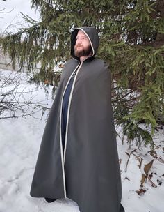 "Shop now Long medieval hooded cloak for men! Medieval hooded cloak in dark green with beautiful trim embellishment. Awesome Medieval prince' cape, viking cloak, elven hooded cape. Just perfect for LARP events, viking festivals, renfaire events etc. See more hooded cloaks here https://www.etsy.com/shop/EthnicandMedieval?ref=seller-platform-mcnav&section_id=35034993 The length (top shoulder to hem) - 59\" (150 cm).  The fabric is a lightweight polyester, really stunning colour. It has a velvet sh Elvish Hooded Cape For Costume Party, Medieval Cape For Fantasy Events, Halloween Cape For Larp Events, Elven Cape Outerwear For Costume, Hooded Cape For Fantasy Events In Winter, Halloween Cape For Larp, Capes For Men Cloaks, Halloween Cape Outerwear For Larp, Hooded Winter Cape For Fantasy Events