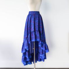 This bohemian hi low ruffle skirt is full of sway and flow. It's a graceful, romantic maxi skirt that's hits at the knee in the center front and drapes beautifully all the way around. A full twirling skirt, this can easily be paired with flats for a day at the beach, or paired with our infinity convertible tops for a more formal occasion. It's lightweight, easy to wash/dry and so easy to pack for all your vacations! Note: You will be stopped and admired when you wear this out! ► Size XS & S of P Summer Skirt Long, Bohemian Robes, Hi Low Skirt, Bohemian Maxi Skirt, Flare Maxi Skirt, Long Floral Skirt, Hi Low Skirts, Modern Kimono, Ruffle Maxi Skirt