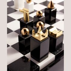 black and white chess board with gold pieces