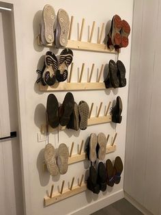 there are many pairs of shoes hanging on the wall