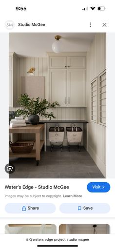 an image of a kitchen with white cabinets and gray tile flooring on the bottom right hand corner