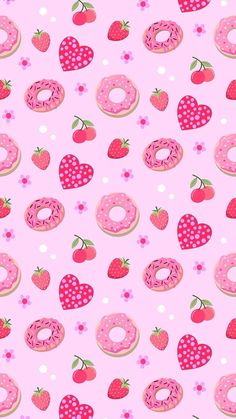 a pink background with donuts and strawberries