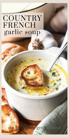 a bowl of soup with bread on the side and text that reads country french garlic soup