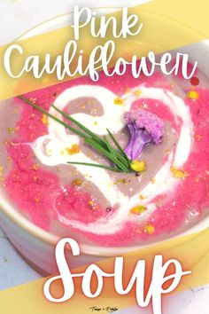 pink cauliflower soup in a yellow bowl with the words, pink cauliflower soup