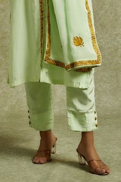 Green shirt style kurta placement embroidered with kashmiri aari. Paired with a plain straight pant and dupatta with matching placed embroidery. - Aza Fashions Festive Pista Green Palazzo Set With Embroidered Border, Festive Pants With Embroidered Border For Festivals, Traditional Designer Pants With Gota Work, Pista Green Traditional Wear With Embroidered Border, Festive Designer Embroidered Pants, Pista Green Palazzo Set With Embroidered Border, Festive Embroidered Designer Pants, Chanderi Embroidered Pants For Designer Wear, Pista Green Cotton Silk Sets With Embroidered Border