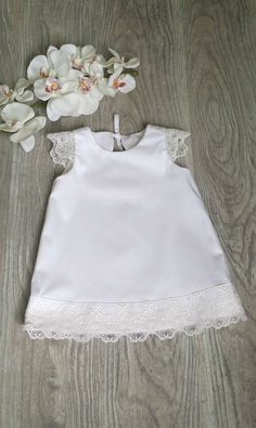 This white A-line christening dress is made from cotton and cotton lace. Ideal for christening, bridesmaid or any other special occasion. *100% Handmade *97% cotton, 3% elastane. *Also we can sew matching accessories like headband, bonnet or booties. Please, note the measurements of each size before placing your order. SIZES: 0-3 months chest: 48cm/19in length: 42.5cm/16.7in 3-6 months chest: 52cm/20.5in length: 45.5cm/17.9in 6-9 months chest: 54cm/21.3in length: 48.5cm/19in 9-12 months chest: 5 Elegant First Communion Dress For Summer, Elegant Spring Baptism Dress With Lace Collar, White A-line Dresses With Lace Collar, First Communion Lace Patchwork Dress For Spring, First Communion Spring Dress With Lace Patchwork, Spring First Communion Dress With Lace Patchwork, Spring Lace Baptism Dress With Lace Collar, Lace Dress For First Communion In Summer, White Lace Dress For Baptism In Spring