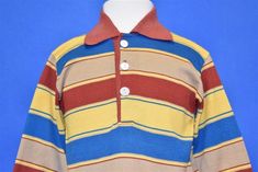 Chest 11.5 in.Length 15 in. Sleeve 10.5 in. Tag Says: no tagThis sweet vintage 70s polo tee has long sleeves and multi-colored horizontal stripes throughout in tan, red, yellow, and blue.  Comments: Fits like a modern unisex toddler 2T.   BABY-100930 Red Yellow Blue Outfit, Vintage Kidcore, Primary Colors Outfit, Kidcore Aesthetic Fashion, Weirdcore Fashion, Kidcore Clothes, Weird Shirts, Polo T Shirts, Yellow Shirts