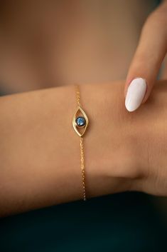 🧿 The Charm of Personalized Protection   In search of the perfect birthday gift for her or a heartfelt personalized gift for mom? Explore the allure of the Evil Eye Bracelet. This exquisitely designed bracelet, bearing an eye-shaped pendant with a mesmerizing blue stone at its heart, is more than just a piece of jewelry. It represents a shield of protection, echoing traditions that span centuries. Seamlessly blending ancient tales with modern elegance, it's the ideal pick for those who treasure sentiment and history in the accessories they adorn. 📏 Perfect Fit, Just For You   Crafted with meticulous attention to detail, this bracelet offers a comfortable length of 16 cm, with an added 3 cm extension, ensuring a total of 19 cm for a versatile and snug fit for various wrist sizes. 🚀 Swift Cheap Silver Spiritual Evil Eye Bracelet, Cheap Hypoallergenic Evil Eye Bracelet Gift, Cheap Blue Evil Eye Bracelet Gift, Gold Gemstone Bracelets As Gift, Spiritual Bracelet For Birthday Gift, Elegant Bracelet For Birthday And Mother's Day, Yellow Gold Bracelets For Mother's Day Birthday, Yellow Gold Bracelets For Birthday And Mother's Day, Blue Bracelets For Valentine's Day Gift