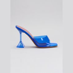 Amina Muaddi metallic leather and PVC sandals. 1.5" transparent pedestal heel. Elongated square open toe. Slide style. Leather lining and sole. "Lupita" is made in Italy. Amina Muaddi Lupita, Amina Muaddi, Metallic Leather, Luxury Outfits, Slide Sandals, Electric Blue, Mule Shoe, Open Toe, Kitten Heels