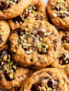 chocolate chip cookies with pistachios and almonds on a white platter