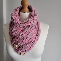 Chunky cowl scarf in pink mixed yarn combination and button detail. Made from 100% acrylic yarn this cowl scarf is great to keep your neck warm in the winter. Pink Knitted Scarves For Winter, Pink Knitted Fall Scarf, Pink Neck Scarf, Winter Scarf Pink, Pink Knitted Winter Scarves, Pink Blanket Scarf, Cashmere Scarf Pink, Chunky Cowls, Cowl Scarf