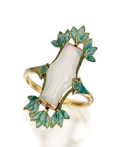 GOLD, OPAL AND ENAMEL RING, GEORGES FOUQUET, CIRCA 1900-1910 Set in the center with a fancy-shaped opal, within a frame of foliate design applied with bluish-green enamel, size 7, signed G. Fouquet, numbered 9730, maker's marks, French assay mark. Enamel Ring, Vintage Jewels, Art Deco Jewelry