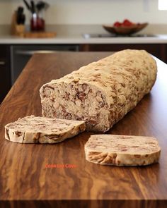 a loaf of bread sitting on top of a wooden counter