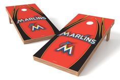 two red and black cornhole game boards with the word marlins on each one side