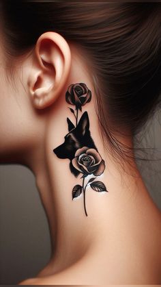 a woman's neck tattoo with black roses on the back of her neck and behind her ear