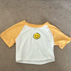 Nwot Great Condition Size Small Smoke Free Home Ships Quickly Bundle To Save!! Cute Yellow Summer Tops, Spring Crew Neck Top With Smiley Face, Cute Cotton Tops With Smiley Face, Cute Smiley Face Tops For Summer, Spring Smiley Face Crew Neck Top, Yellow Cotton Short Sleeve Crop Top, Playful White Top With Smiley Face, Yellow Cotton Crop Top With Short Sleeves, Playful Smiley Face Tops For Spring