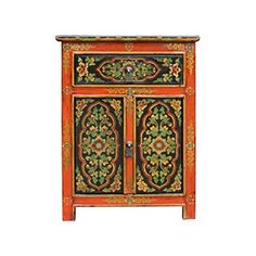 an orange and black cabinet with floral designs on the doors, painted in different colors