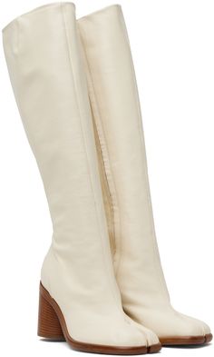 Find MAISON MARGIELA White Tabi Boots on Editorialist. Knee-high grained nappa leather boots in white. · Cleft toe · Zip closure at inner side · Buffed calfskin lining · Stacked leather cylindrical heel with rubber injection · Calfskin sole · Heel: H3 in Supplier color: White Tabi Boots, Boots Knee, Nappa Leather, Knee High Boots, Leather Boots, Knee High, Calf Skin, Color White, Women Wear