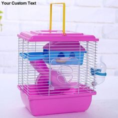 a pink and blue bird in a cage on top of a white table next to a potted plant