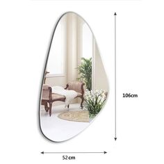 an oval mirror is shown with measurements for the size and shape of it, as well as