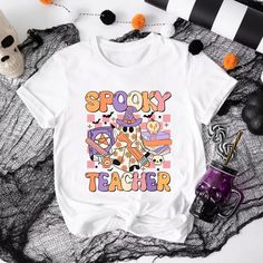 Spooky Teacher Halloween Shirt - Cute Ghost Teacher T-Shirt 🎃  How to Order Shirts 🎃 1) Choose your preferred size, color and quantity from the dropdown menus 2) then click add basket. 3) Click "Proceed to check out *For additional units: simply repeat the process (The second item has a lower shipping cost.) �🎃 Product 🎃 The unisex heavy cotton tee is a wardrobe staple, perfect for casual fashion. It's made with medium-weight, 100% cotton fabric (5.3 oz/yd², 180 g/m²) for year-round comfort a Fall Classroom, Teacher Halloween, Teachers Halloween, Teacher Tshirts, Cute Ghost, Fall Fun, Teacher Gift, Halloween Shirt, Heavy Cotton