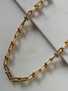 24k gold overlay brass necklace measures 15” (adjustable links) Two styles available pictured; style “thick”