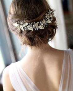 an image of a woman wearing a wedding hair piece