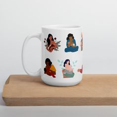 a white coffee mug sitting on top of a wooden table