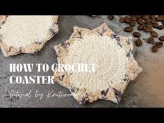 two crocheted coasters sitting on top of a table next to coffee beans