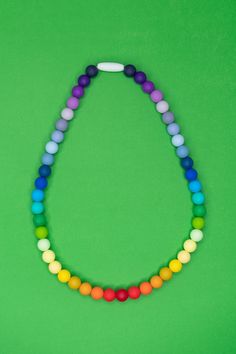 Fun necklace for kids! Wear as a fun rainbow necklace or use for your kid to fidget with or chew! If (and when!) they decide to put it in their mouth, it's 100% safe to chew! RECOMMENDED AGE: 3+ DETAILS: Features a breakaway safety clasp for quick release. 100% food grade silicone beads Free of BPA, PVC, phthalates, lead and cadmium CARE: Wash in warm soapy water Lay flat to dry These necklaces are perfect if your child needs on-the-go oral sensory input. Kidcore Accessories, Rainbow Sensory, Necklace For Kids, Toddler Necklace, Chew Necklace, Sensory Input, Daisy Mae, Kids Sensory, Rainbow Jewelry