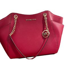 Michael Kors Marilyn Red Robin Saffiano Leather Medium Tote Bag Handbag Is A Beautiful Handbag That Will Add A Touch Of Glamor To Your Daily Routine. It Is Perfect For Women Who Want To Keep Things Organized And Stylish While On-The-Go. The Bag Has A Spacious Interior That Can Accommodate All Of Your Essentials, And The Gold-Tone Chain Strap Adds An Elegant Touch To The Design. The Exterior Of The Handbag Is Made Of Saffiano Leather, Which Is Durable And Resistant To Scuffs And Scratches. This I Red Evening Bag With Interior Card Slots, Red Evening Bags With Interior Card Slots, Designer Red Saffiano Leather Bag, Classic Red Saffiano Leather Bag, Red Saffiano Leather Evening Bags, Elegant Red Saffiano Leather Shoulder Bag, Formal Red Bag With Interior Card Slots, Red Saffiano Leather Bag With Gold-tone Hardware, Red Saffiano Leather Shopping Bag