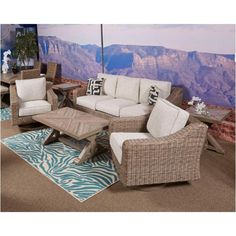 a living room filled with furniture on top of a rug