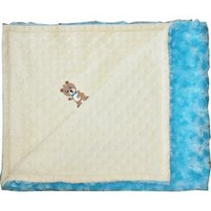 a blue and white blanket with a teddy bear embroidered on the front, along with a light blue border