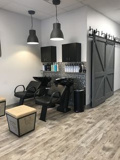 a hair salon with chairs and stools