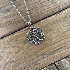 Celtic Triskelion necklace....1 1/2" tall with bail by 1 1/8" wide at the widest spot, cast and antiqued in sterling silver 925...the chain is 20" long also in sterling silver 925 with a lobster catch Viking Pendant Necklace With Oxidized Finish, Viking Style Sterling Silver Nickel-free Necklace, Nickel-free Sterling Silver Viking Necklace, Nickel-free Viking Style Sterling Silver Necklace, Viking Oxidized Pendant Necklace, Handmade Viking Sterling Silver Necklaces, Viking Style Engraved Sterling Silver Necklace, Viking Style Silver Pendant Necklace, Engraved Pewter Necklace With Round Pendant