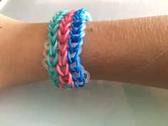 two different colored bracelets on someone's arm